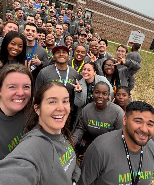 Group photo of Military to Microsoft participants at a Microsoft workforce development center.
