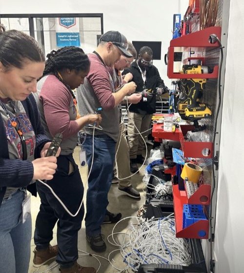 Ashley and other MDP-VETS participants striping wires as a part of the program.