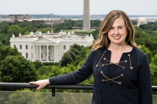Megan Rowley posing in front of the White House during the 2025 Military Spouse Employment Summit. 